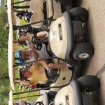 golfers in their carts awaiting the start of the outing